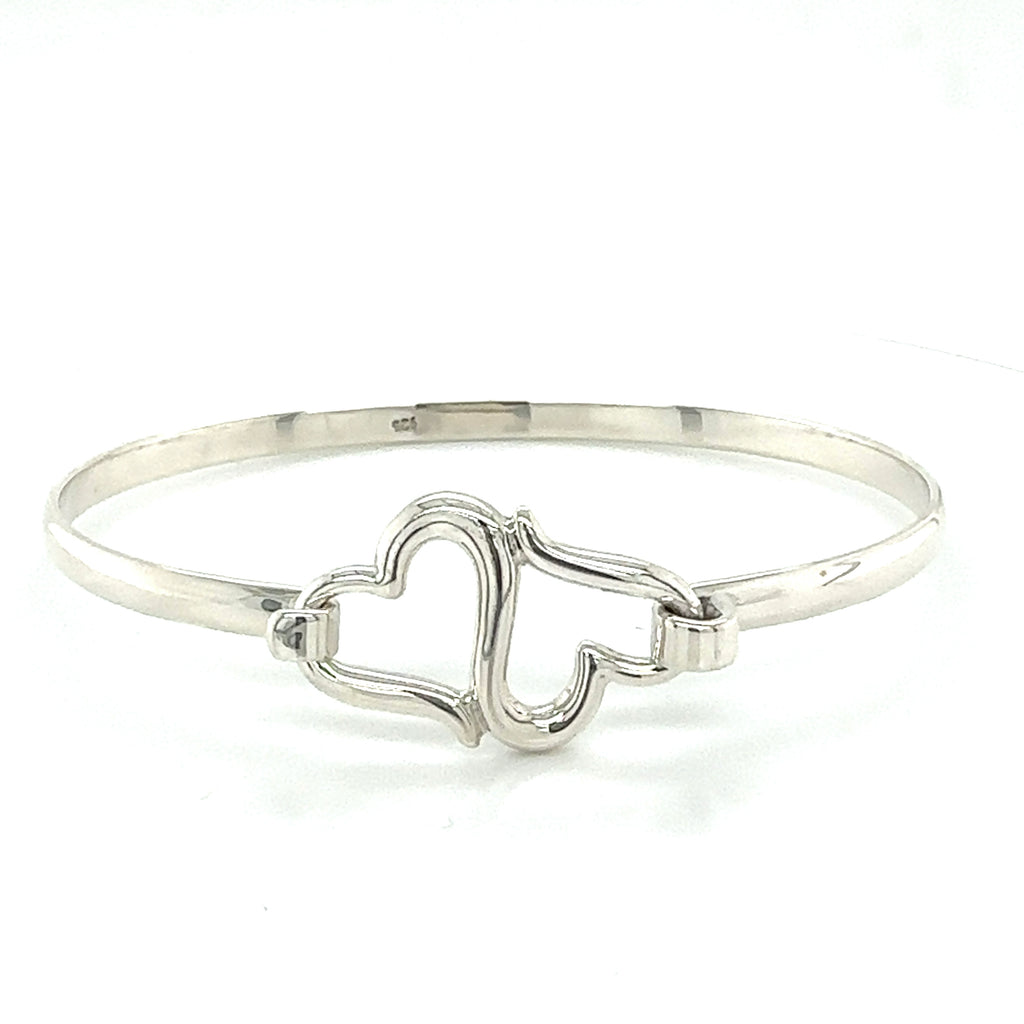Sterling silver bracelet with two hearts