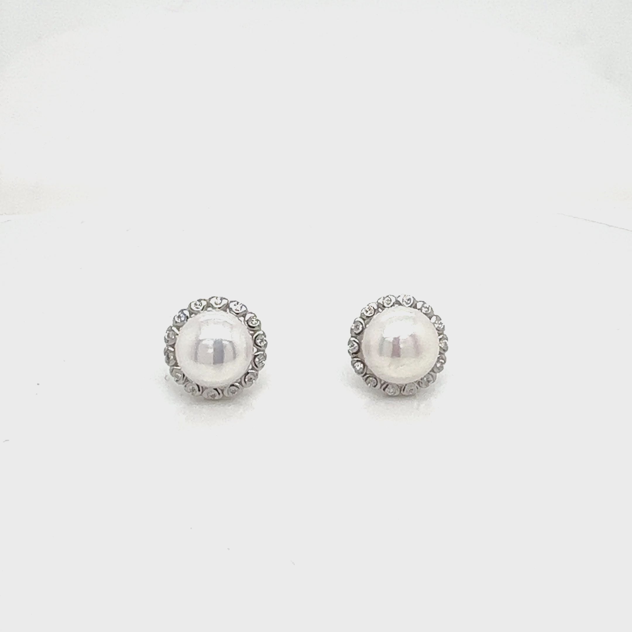 Classic pearl studs with sparkle